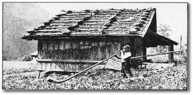 Smoking my pipe outside the house.